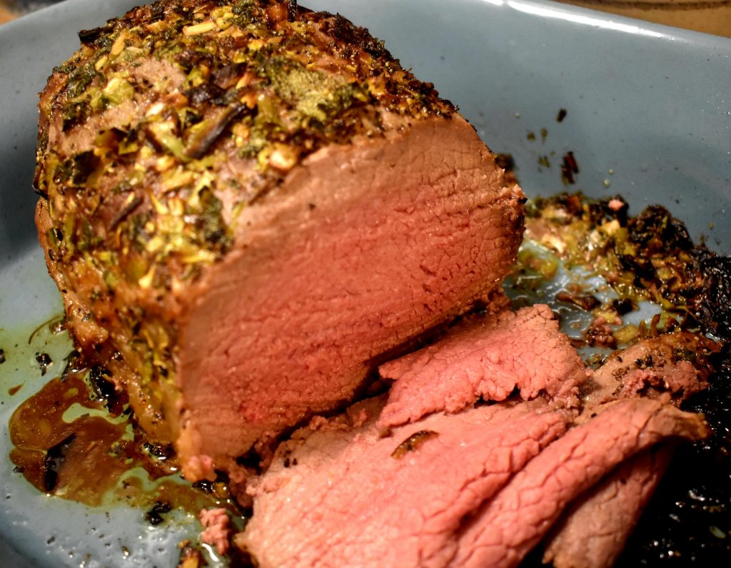 Thinly sliced herb crusted eye of round roast