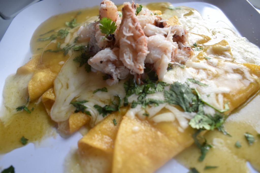 Rich and creamy rolled corn tacos with Dungeness crab piled high