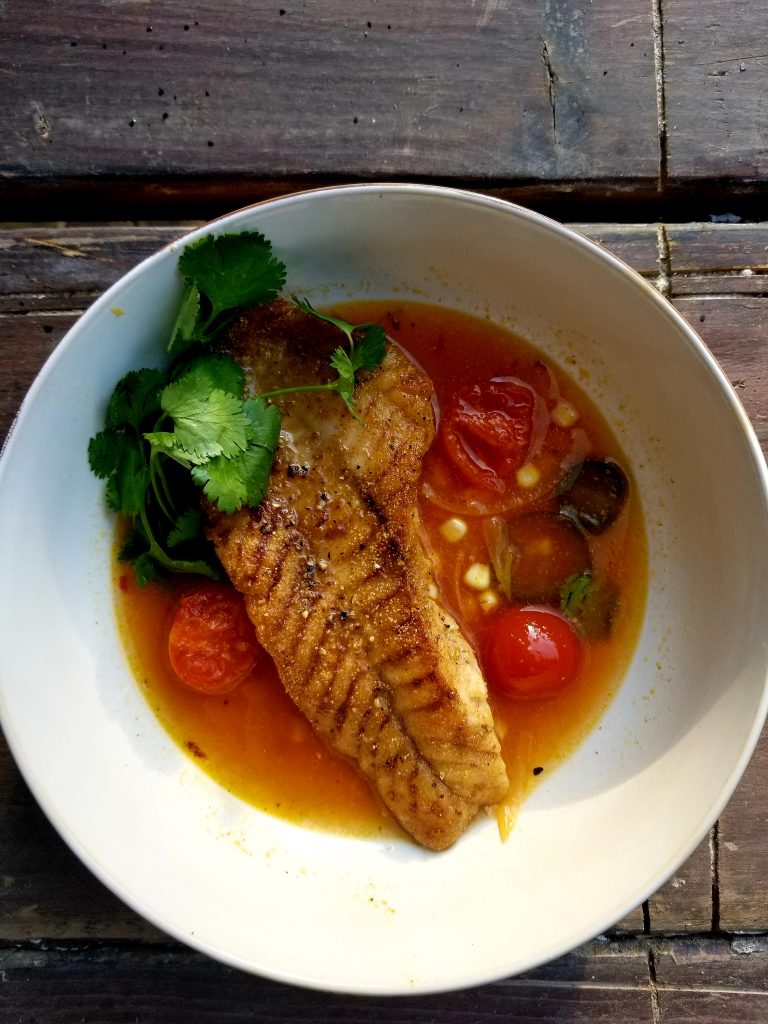 Lightly coated snapper in a spicy tomato broth