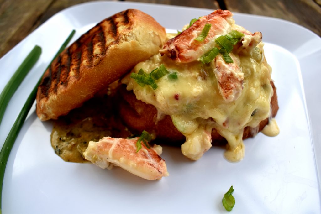 Rich, buttery Dungeness crab, sharp white cheddar and fire roasted tomatillo on a grilled sourdough toast.