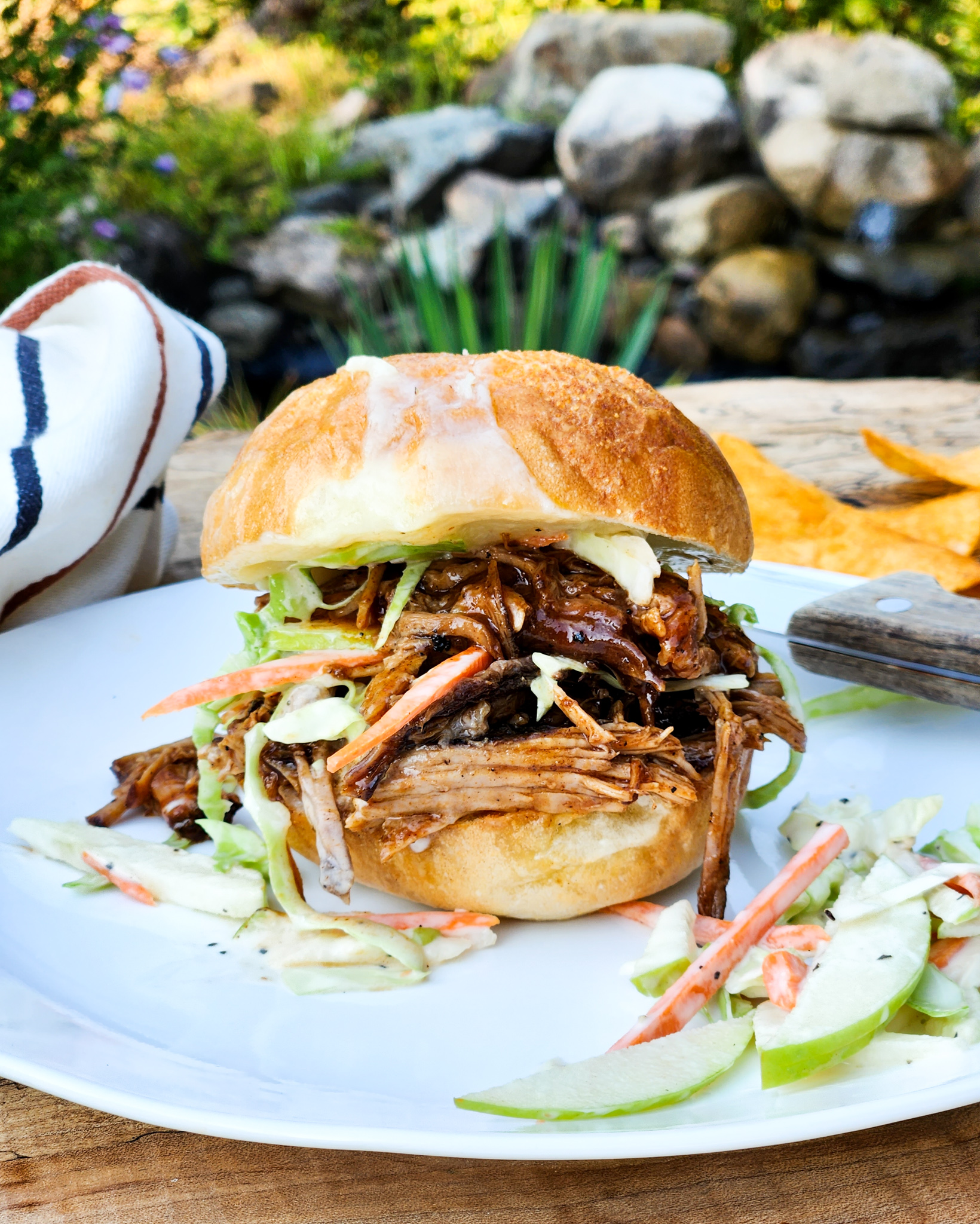 Coca-Cola Pulled Pork Sliders are rich and tangy with creamy apple carrot slaw on a white cheddar toasted slider bun.