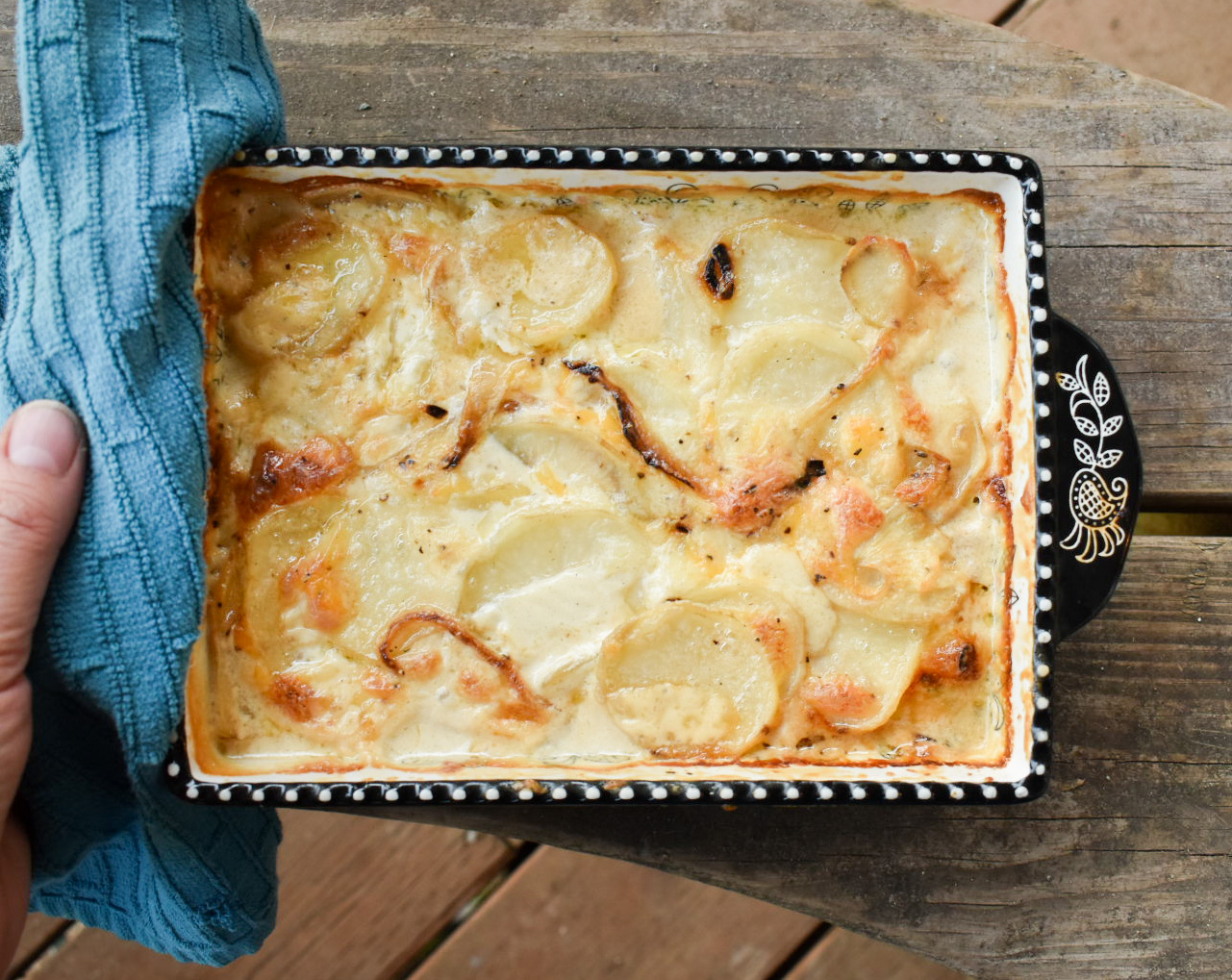Simple, classic layers of potato and creamy cheese with a caramelized top