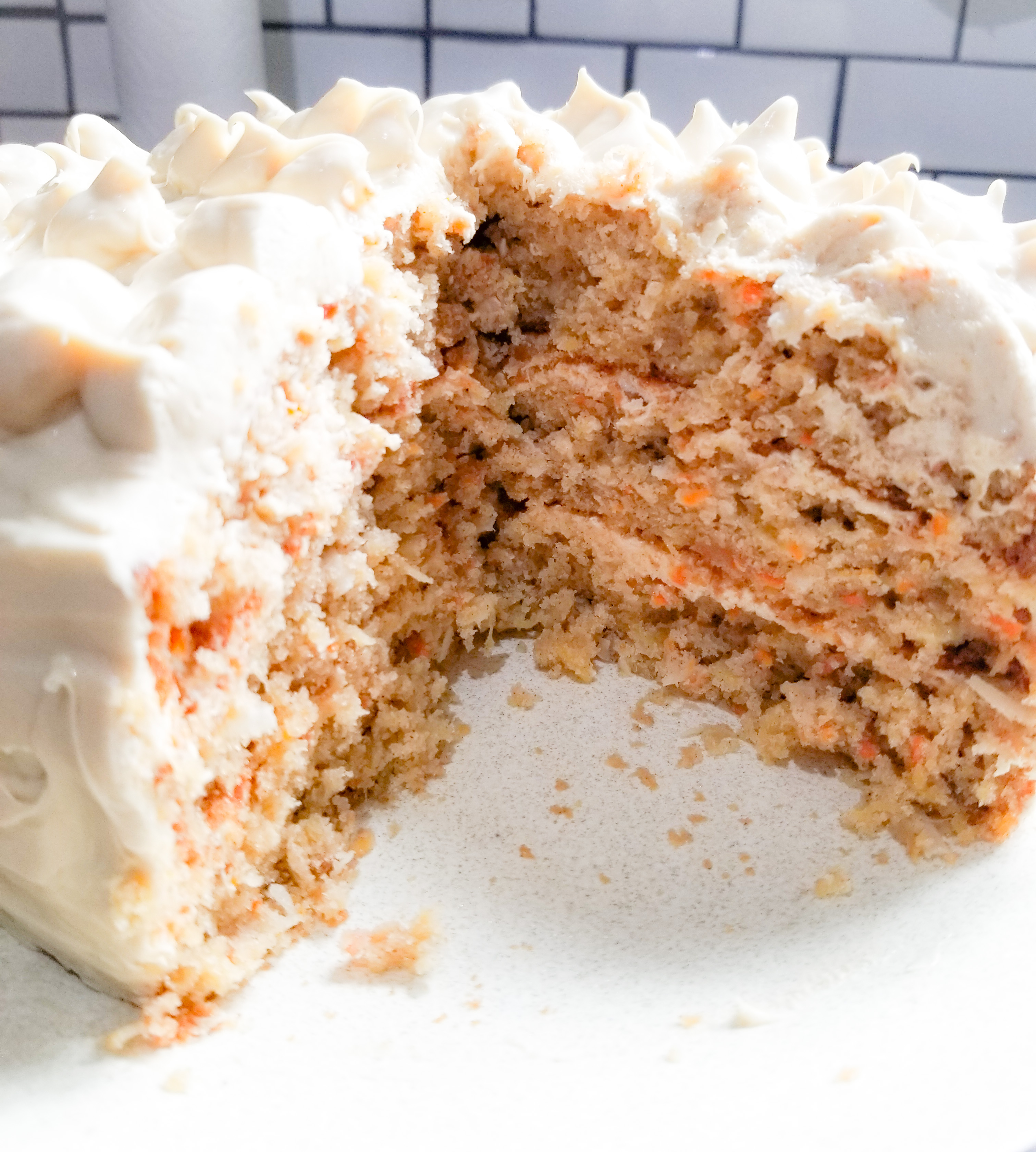 Tired of dry carrot cake? This Triple Layer Carrot Cake is packed with moisture from crushed pineapple and coconut milk.
