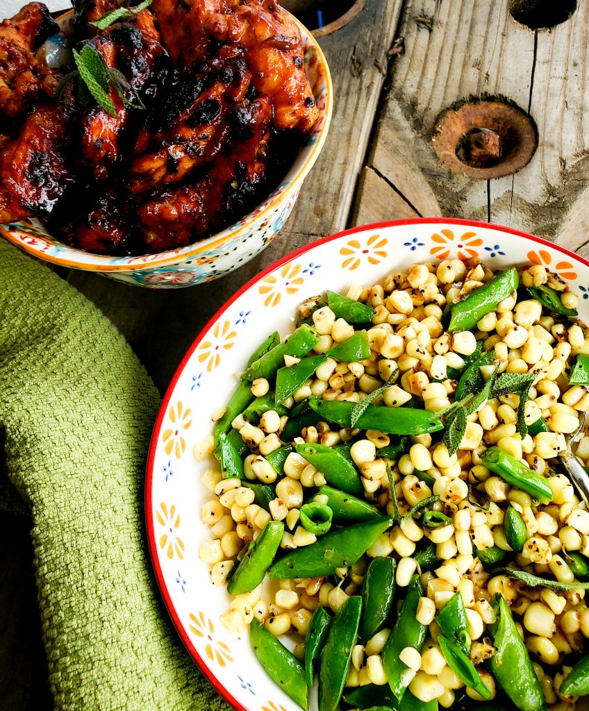 Simple, fresh corn and peas lightly sauteed are the perfect summer side dish that pairs with Sweet & sticky Ribs