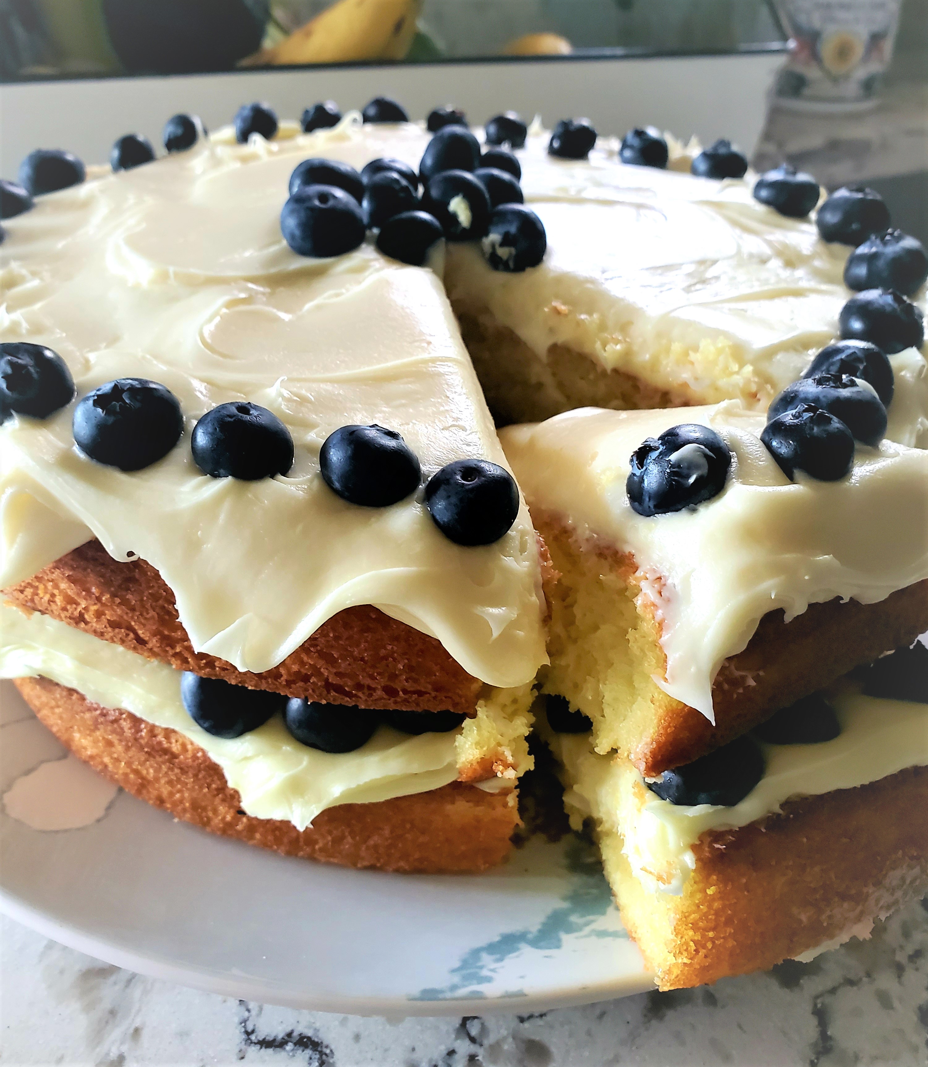 This Lemon Blueberry Cake is a favorite at our house. Perfect for summer grilling parties with it’s bright lemon filling, whipped cream cheese frosting and fresh Driscoll’s blueberries.