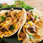 Tender pork gets crisped and served in a charred flour tortilla with corn relish and tomatillo salsa