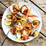 Simple, yet elegant Steamer Clams gently steamed in white wine and fennel with bacon a shallot. A Pacific Northwest favorite served over grilled toast.