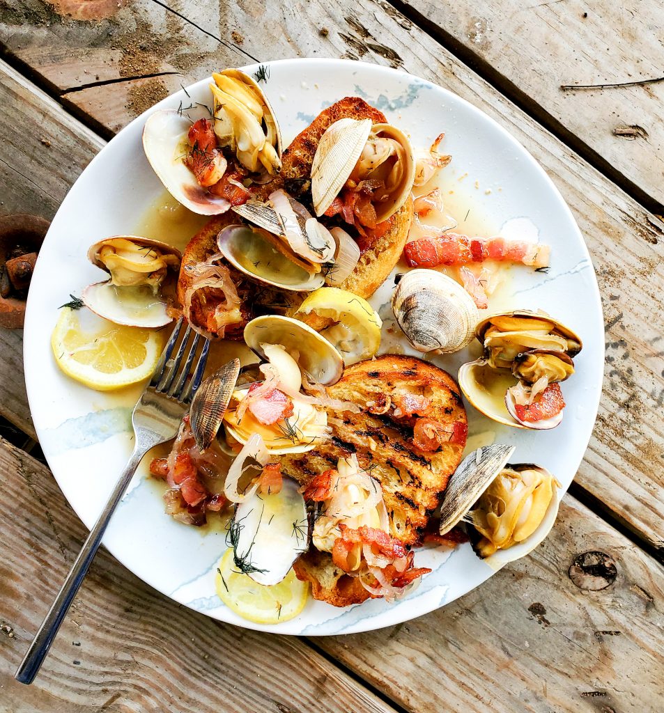 Simple, yet elegant Steamer Clams gently steamed in white wine and fennel with bacon a shallot. A Pacific Northwest favorite served over grilled toast.