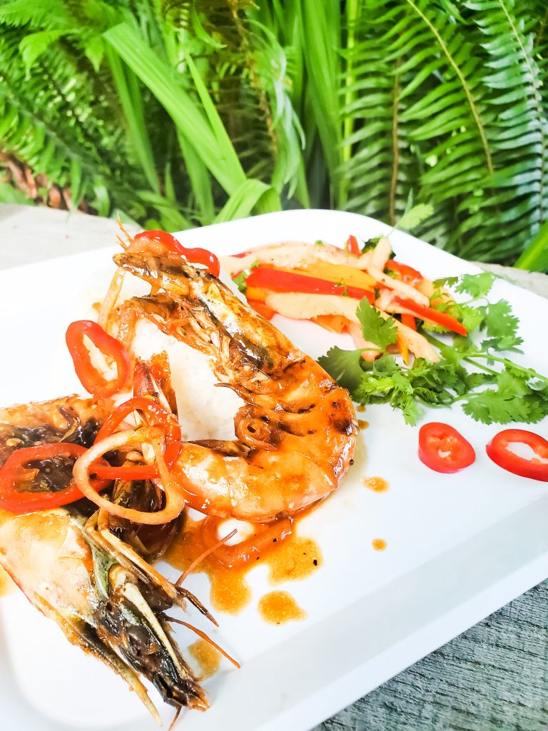 The funnest way to eat shrimp is head on with garlic, chili and shallot.