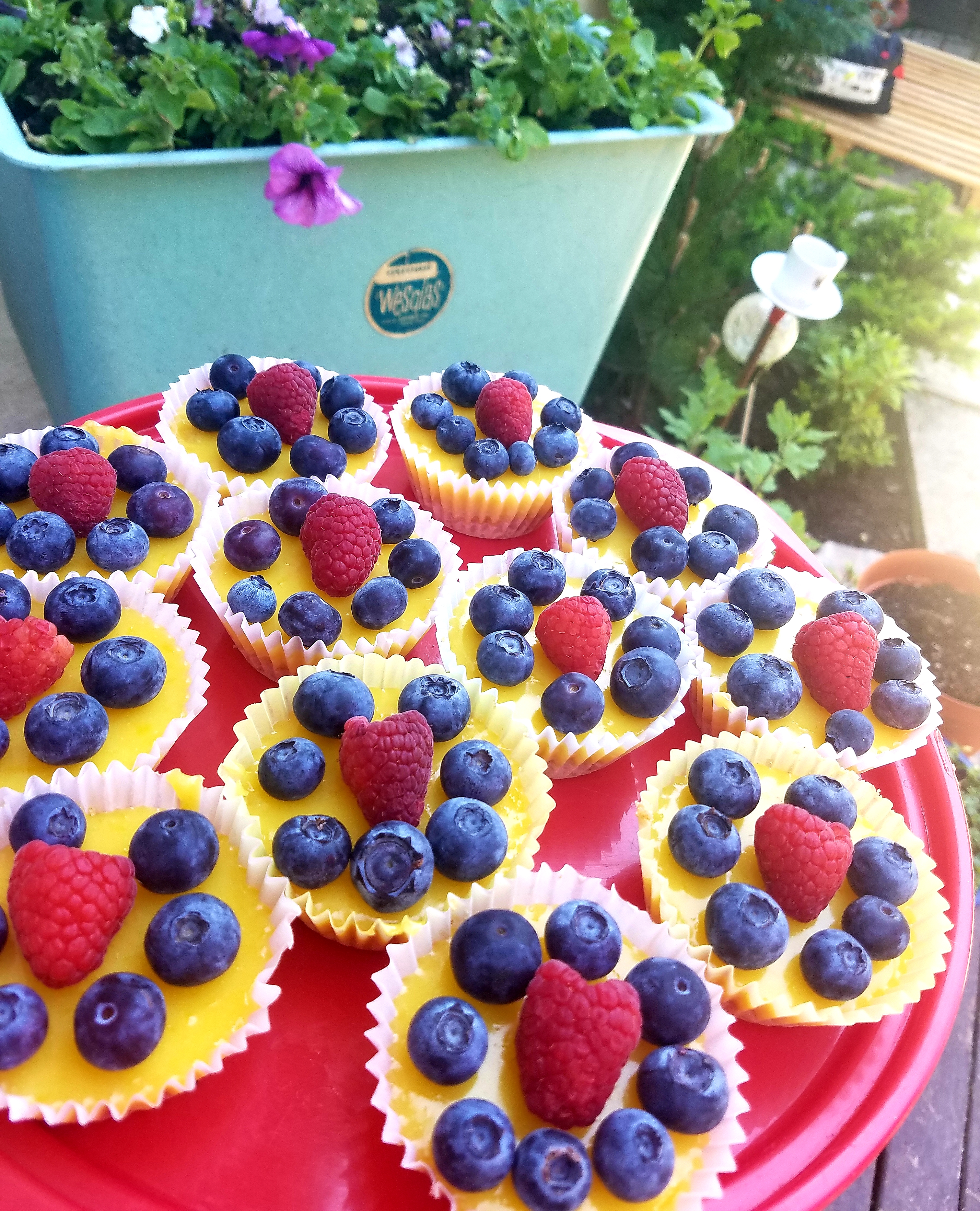 Sweet and tart lemon curd in a graham cracker crust with fresh blueberries and raspberries