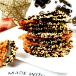 Chocolate Espresso Dipped Hazelnut Lace Cookies get stepped up Seattle style and dipped in dark chocolate espresso with hazelnut crumb.