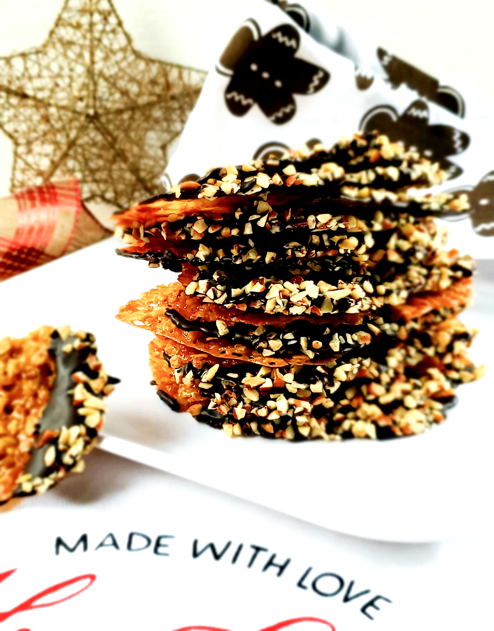 Chocolate Espresso Dipped Hazelnut Lace Cookies get stepped up Seattle style and dipped in dark chocolate espresso with hazelnut crumb.