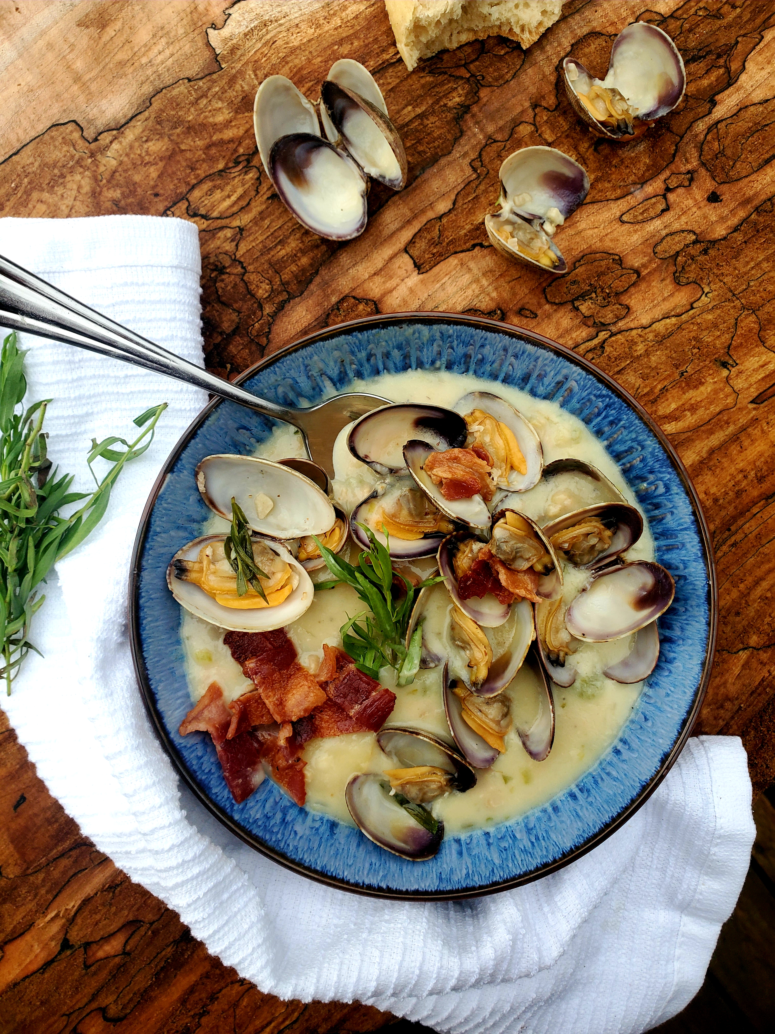This rustic, Farm Style Clam Chowder combines fresh manila clams, sliced baby potatoes, a splash of sherry, cream, tarragon and smokey bacon.