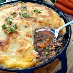 Classic Cottage Pie is a weeknight favorite with spiced ground beef, tender carrots, peas and a creamy potato cheese topping.