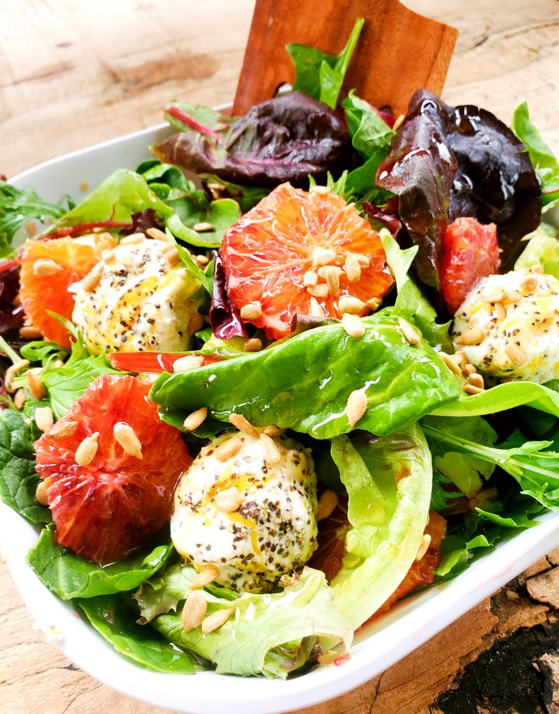 Delicate Spring greens, juicy blood oranges and creamy ricotta rolled in lemon zest and cracked pepper combined with crunchy sunflower seeds. 
