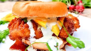 Hot chicken sandwich, creamy jalapeno sauce and fresh mango
