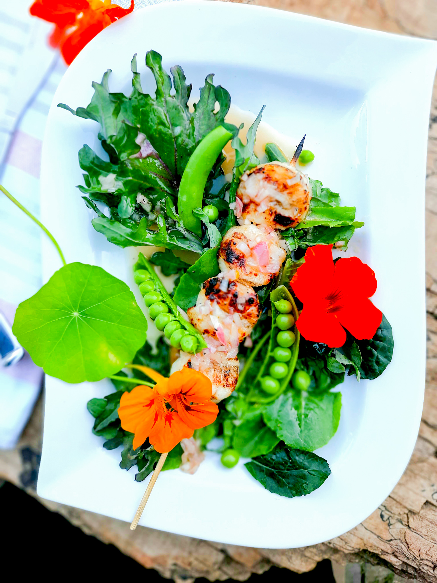 Buttery grilled scallops, smoked citrus shallot field greens