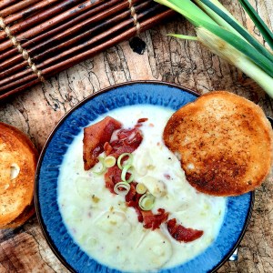 Smoky Potato Leek Soup combines a variety of farm style sliced creamy potatoes, garden leeks, smoked bacon and serrano pepper.