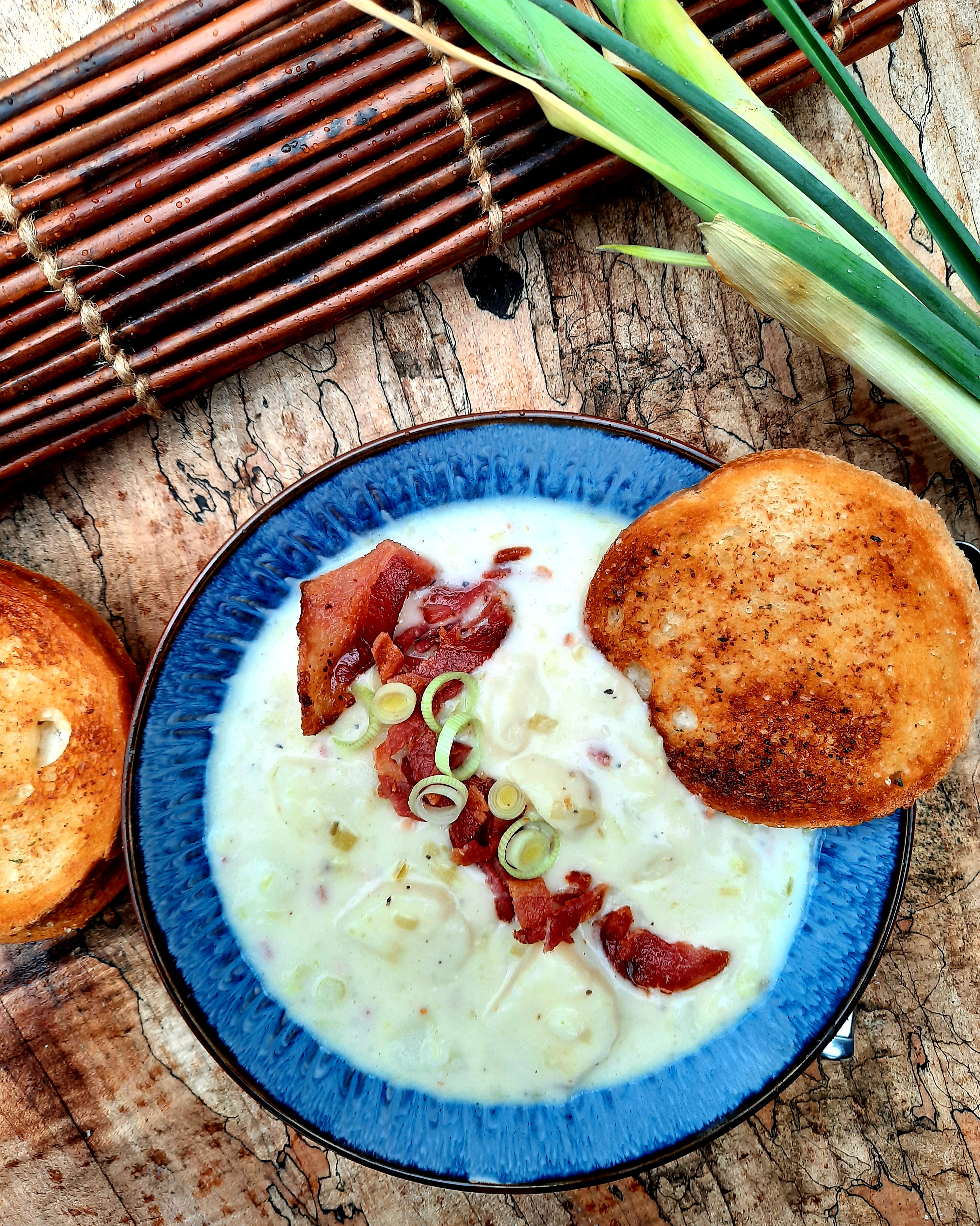 Smoky Potato Leek Soup combines a variety of farm style sliced creamy potatoes, garden leeks, smoked bacon and serrano pepper.