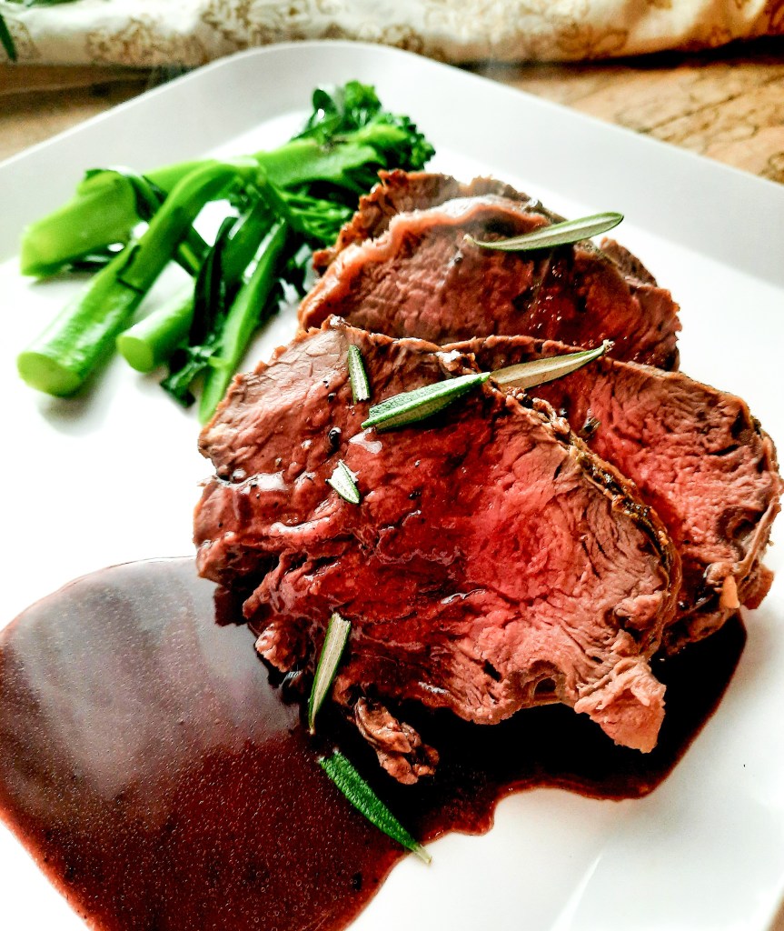 Impress your guests with this easy, but impressive Rosemary Crusted Beef Tenderloin with Port Wine Sauce.