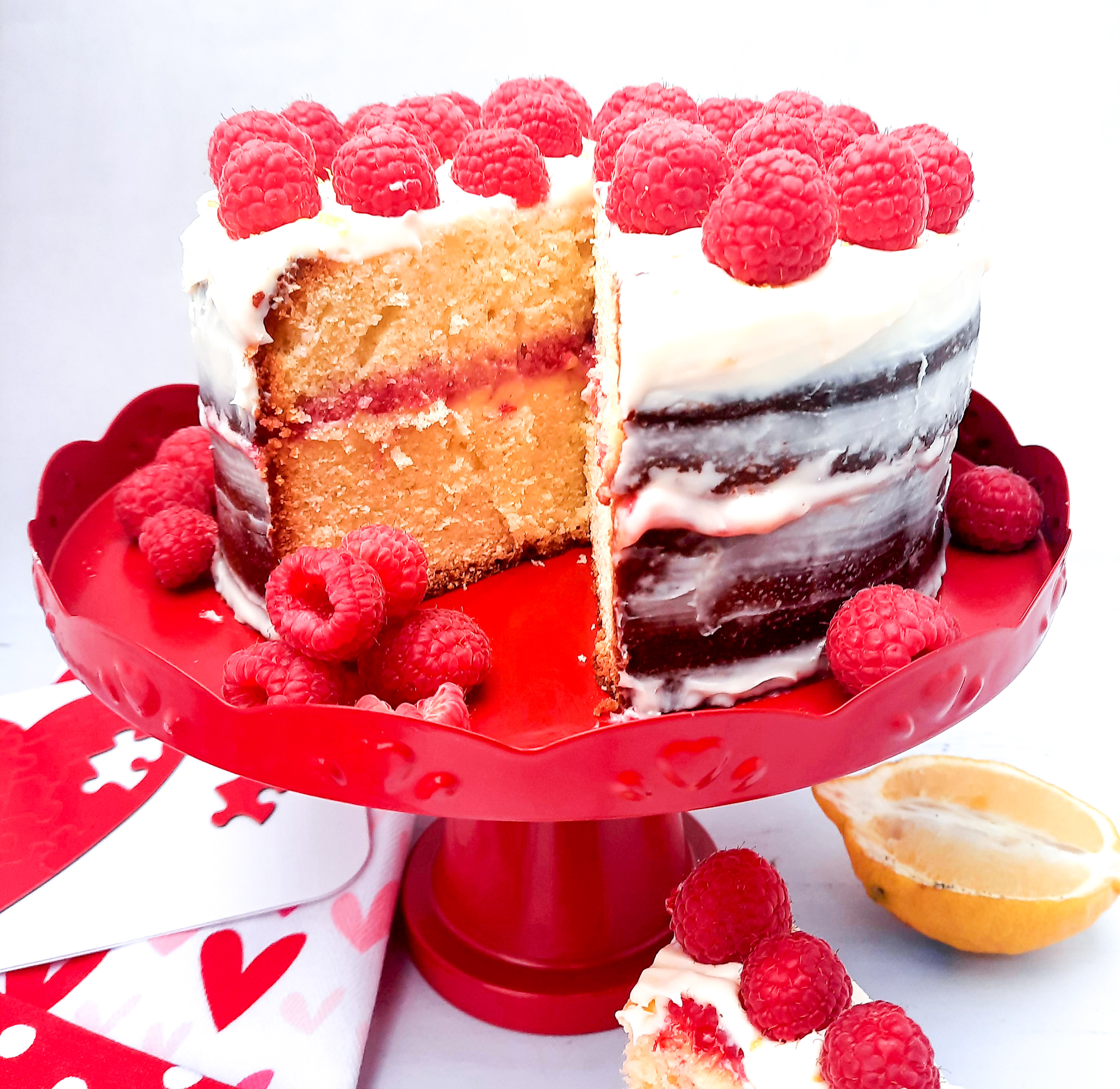 Fresh Raspberry Lemonade Pound Cake, raspberry and lemon cream between buttery lemon pound cake with lemon cream frosting fresh raspberries.