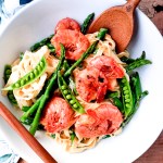 Creamy Spring Pasta with Shrimp combines first of the season asparagus and peas in a cream based sauce with tender garlic shrimp.