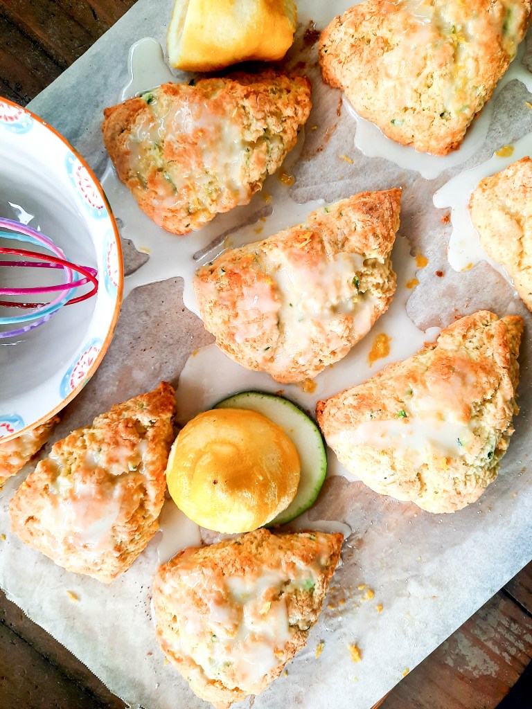 Bright and Citrusy Lemon Zucchini Scones are made bakery style with plenty of shredded zucchini and a sweet lemon zest glaze.