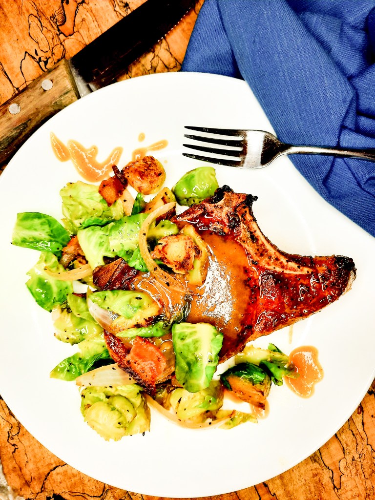 Double-Cut Pork Chops with Spiced Agave Mustard Sauce are pan seared and finished in the oven for an extra juicy pork chop.