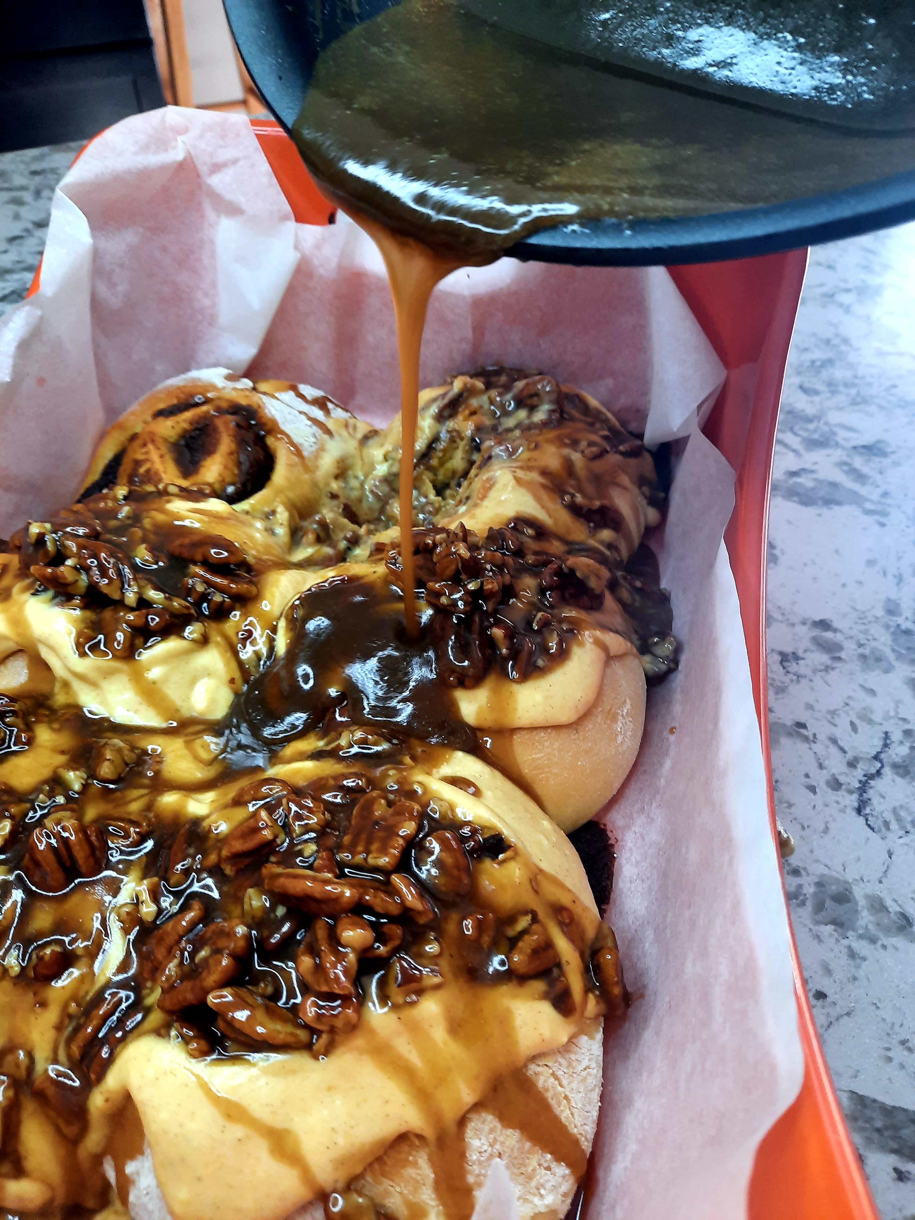 Sticky Pumpkin Pecan Cinnamon Rolls celebrate fall with pumpkin cream cheese frosting and sticky caramel pecan topping.