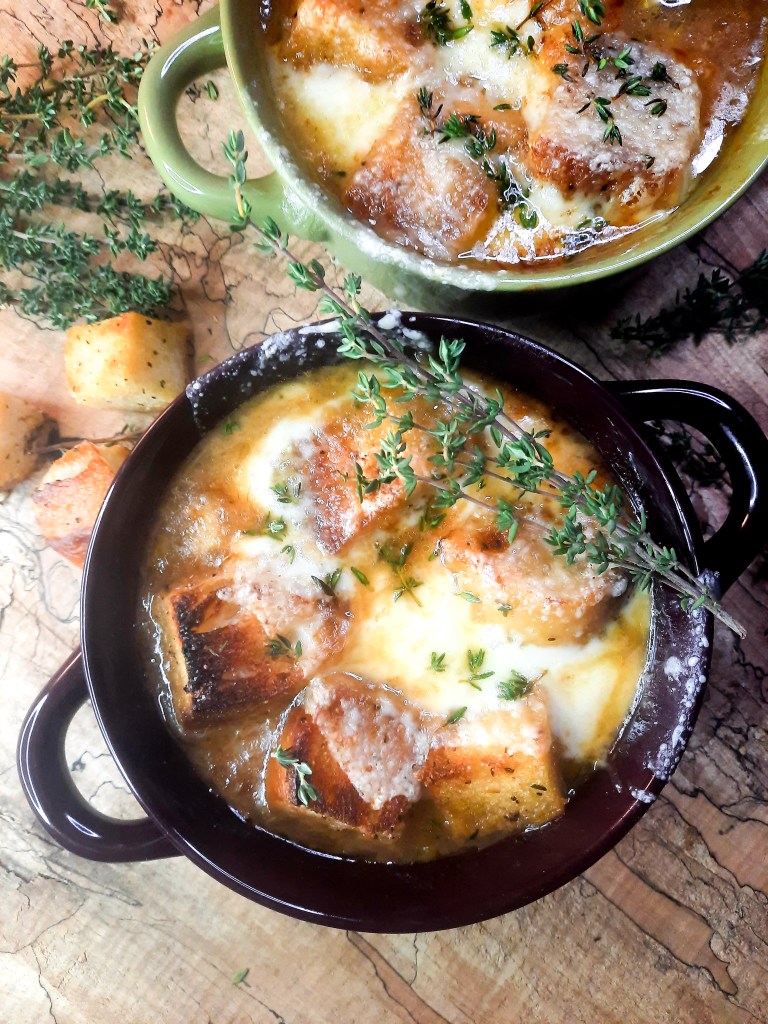 Bistro French Onion Soup with rich, flavorful beef broth and slowly caramelized onions topped with French bread croutons and gruyere cheese.