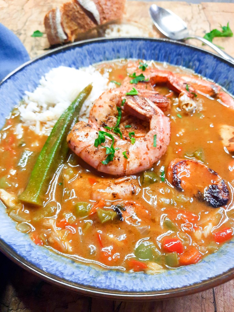 Seafood Gumbo is rich and flavorful from a dark roux with crab, shrimp and spicy andouille sausage.