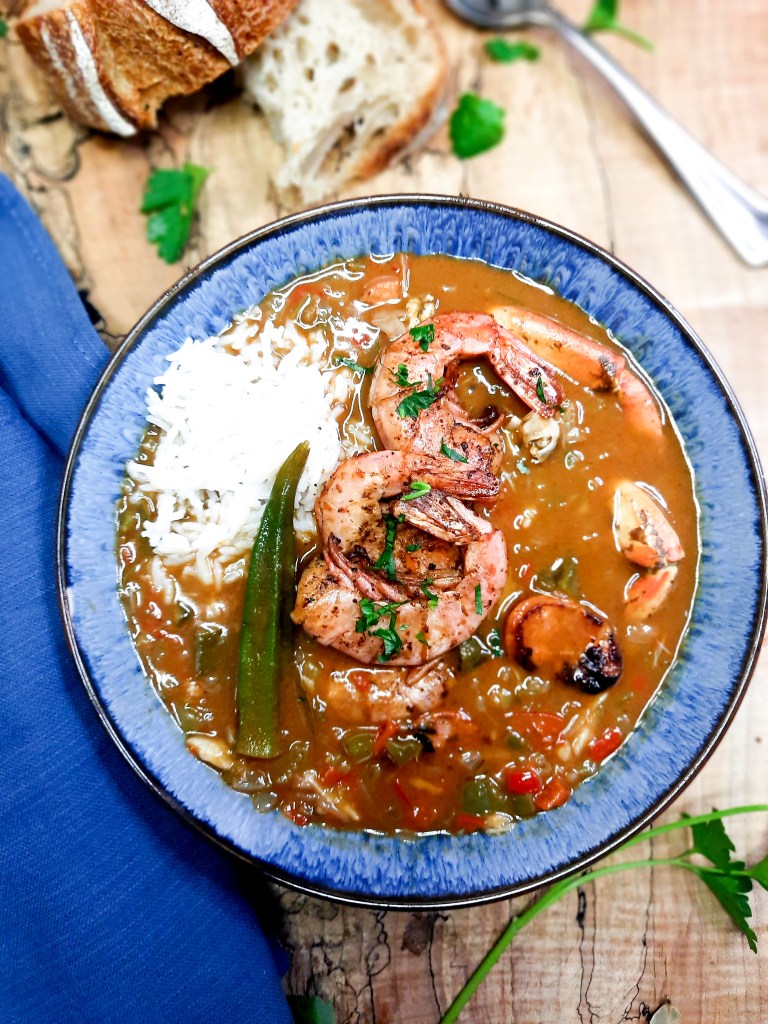 Seafood Gumbo is rich and flavorful from a dark roux with crab, shrimp and spicy andouille sausage.