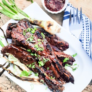 Flanken-Cut Short Ribs marinated in a sweet and slightly smoky raspberry chipotle sauce then grilled and garnished with chopped onion tops.