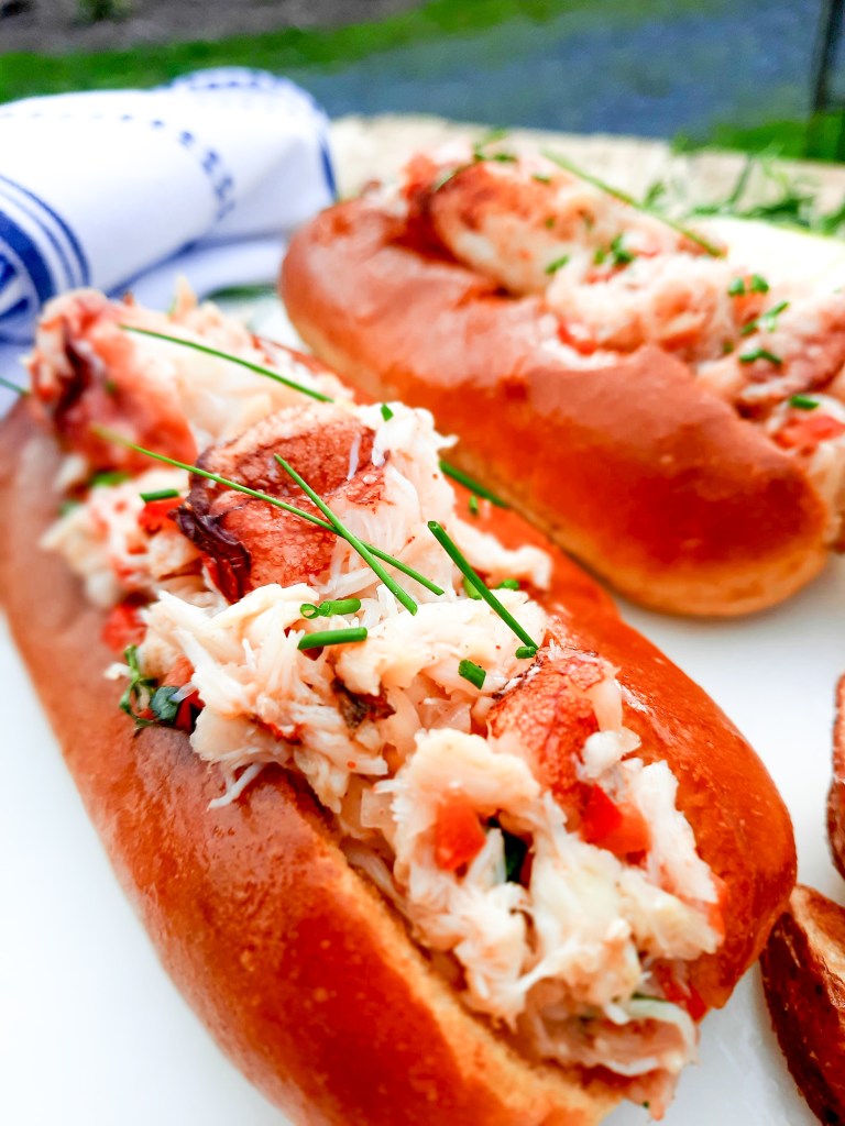 Dungeness Crab Rolls let the crab shine with butter warmed lump pieces, minced red pepper, tarragon, smoky chipotle and a squeeze of lemon. 