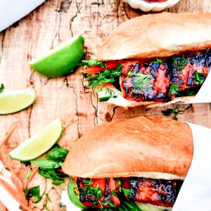 Salmon Bahn Mi Sandwich is a West Coast and Vietnamese fusion with pickled carrot, daikon radish, sriracha mayo and fresh herbs.