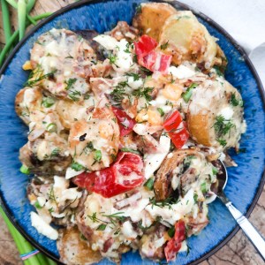 Grilled Potato Salad with Shallot Vinaigrette is a flavorful addition to your table with fresh herbs, bacon, chopped egg and pickled peppers.