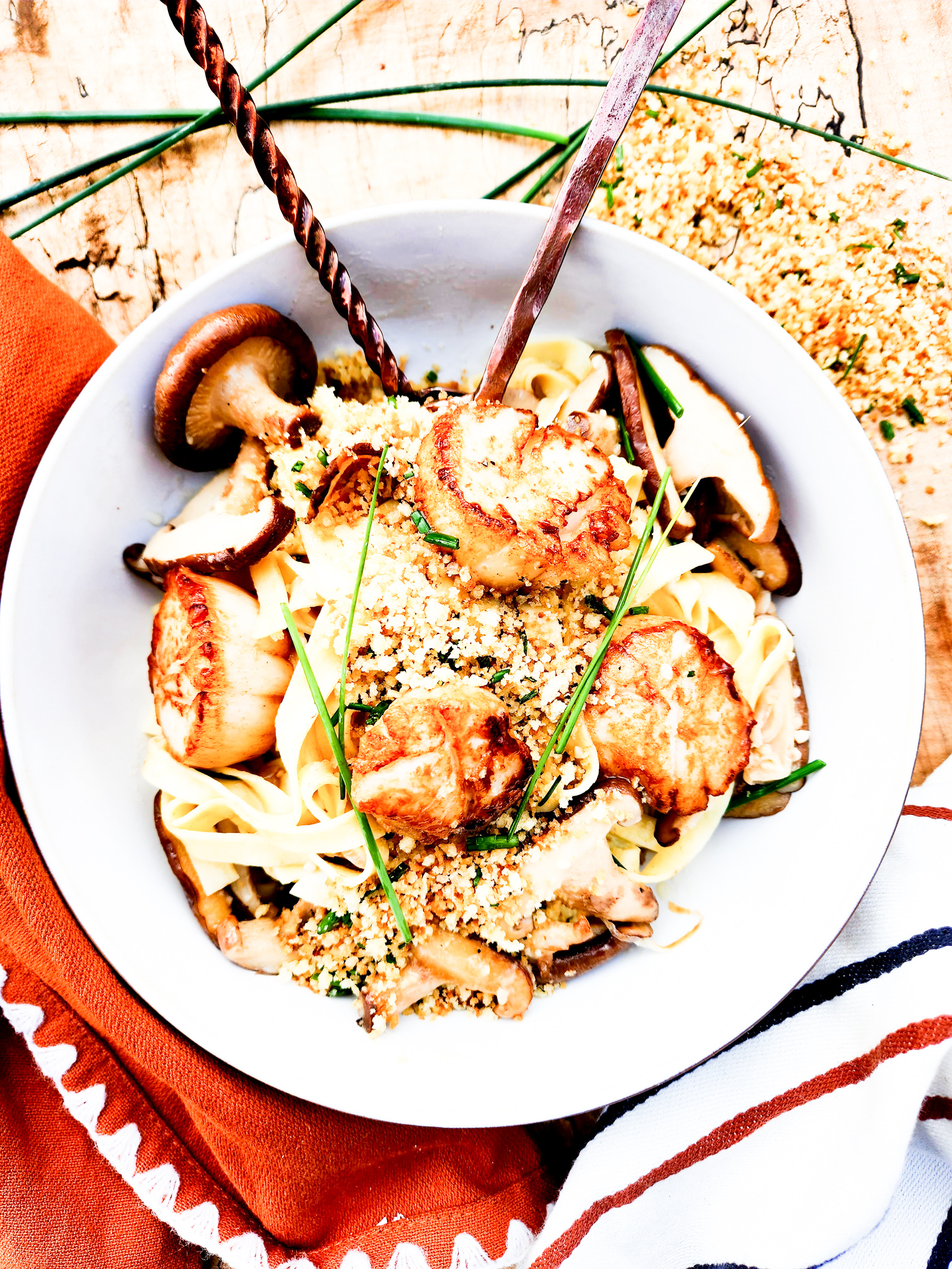 Shiitake & Scallop Fettucine in a buttery garlic shallot sauce with crispy breadcrumbs, parmesan and fresh chives.