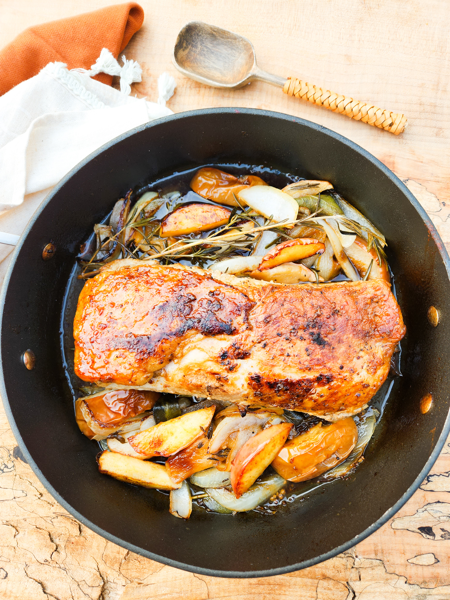 Roasted Pork Loin with Apples seared for ultimate juiciness with a mustard garlic rub and herbs for extra flavor.