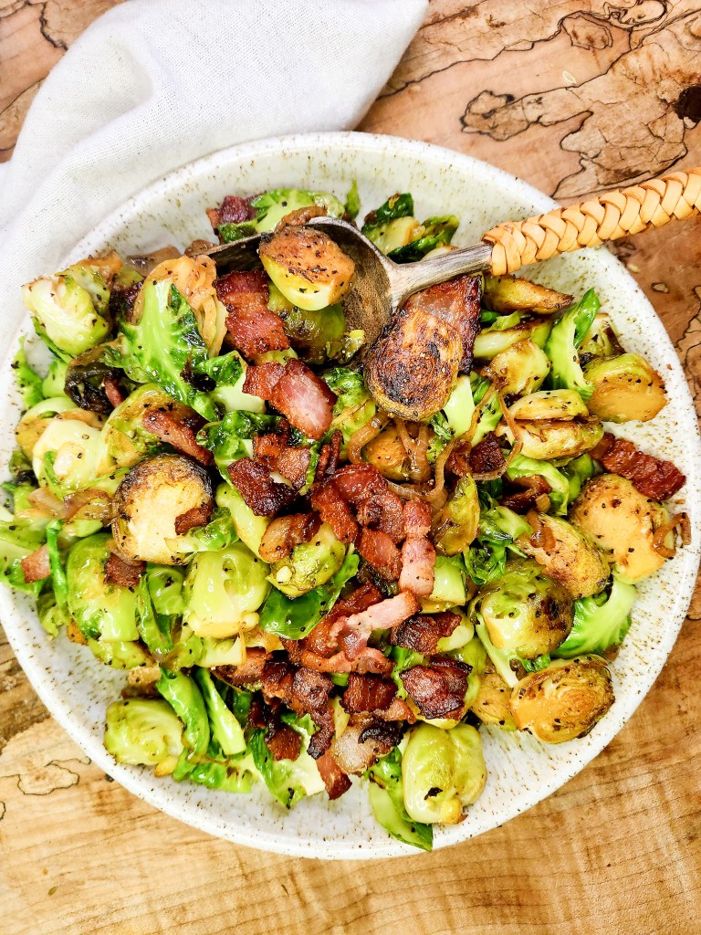 Bacon-Shallot Brussels Sprouts are seared in bacon fat, splashed with sherry wine and seasoned with salt and pepper for a delicious side dish.