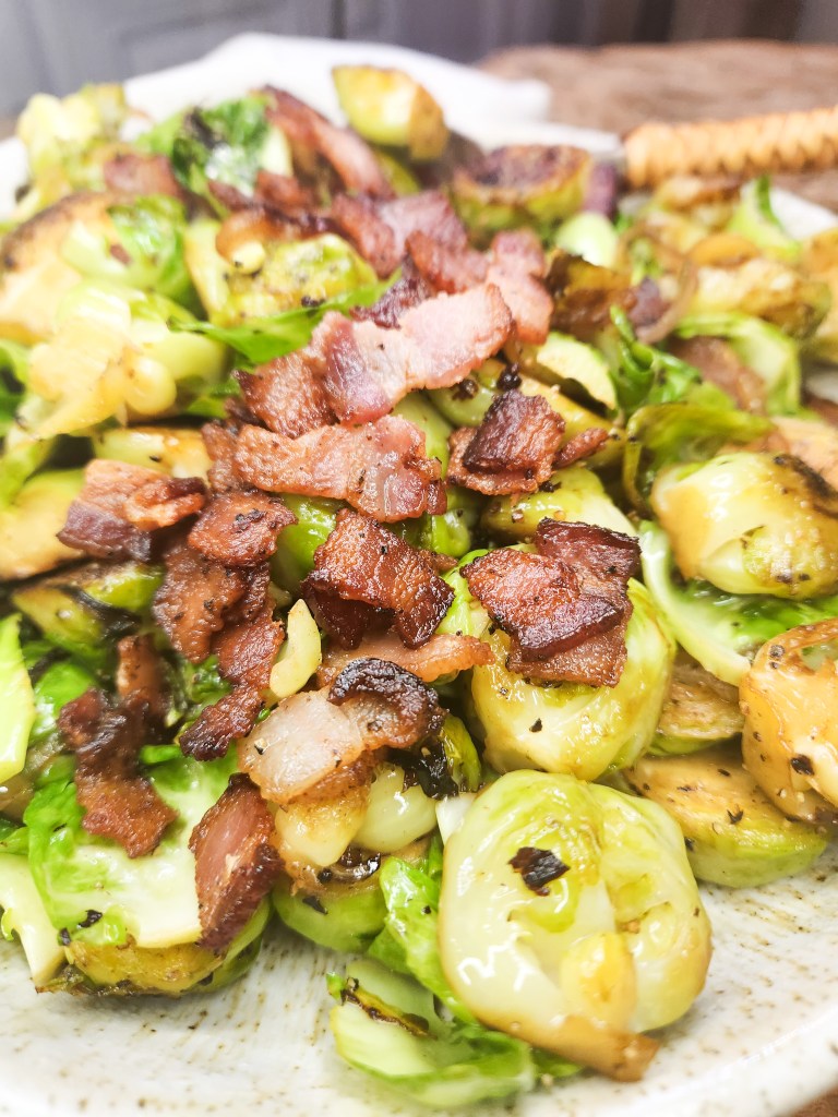 Bacon-Shallot Brussels Sprouts are seared in bacon fat, splashed with sherry wine and seasoned with salt and pepper for a delicious side dish.