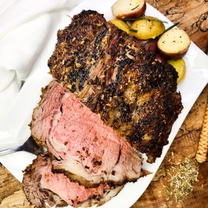 Herb Crusted Prime Rib uses a no-fail method that will definitely impress your guests, with flavors of garlic, fennel seed, coriander and caraway seed.