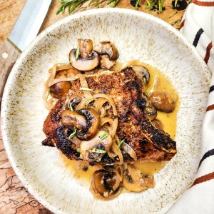 Pork Chops with Mushroom Sauce is an easy weeknight meal with seared chops and a flavorful mushroom sauce with shallot, sherry and butter