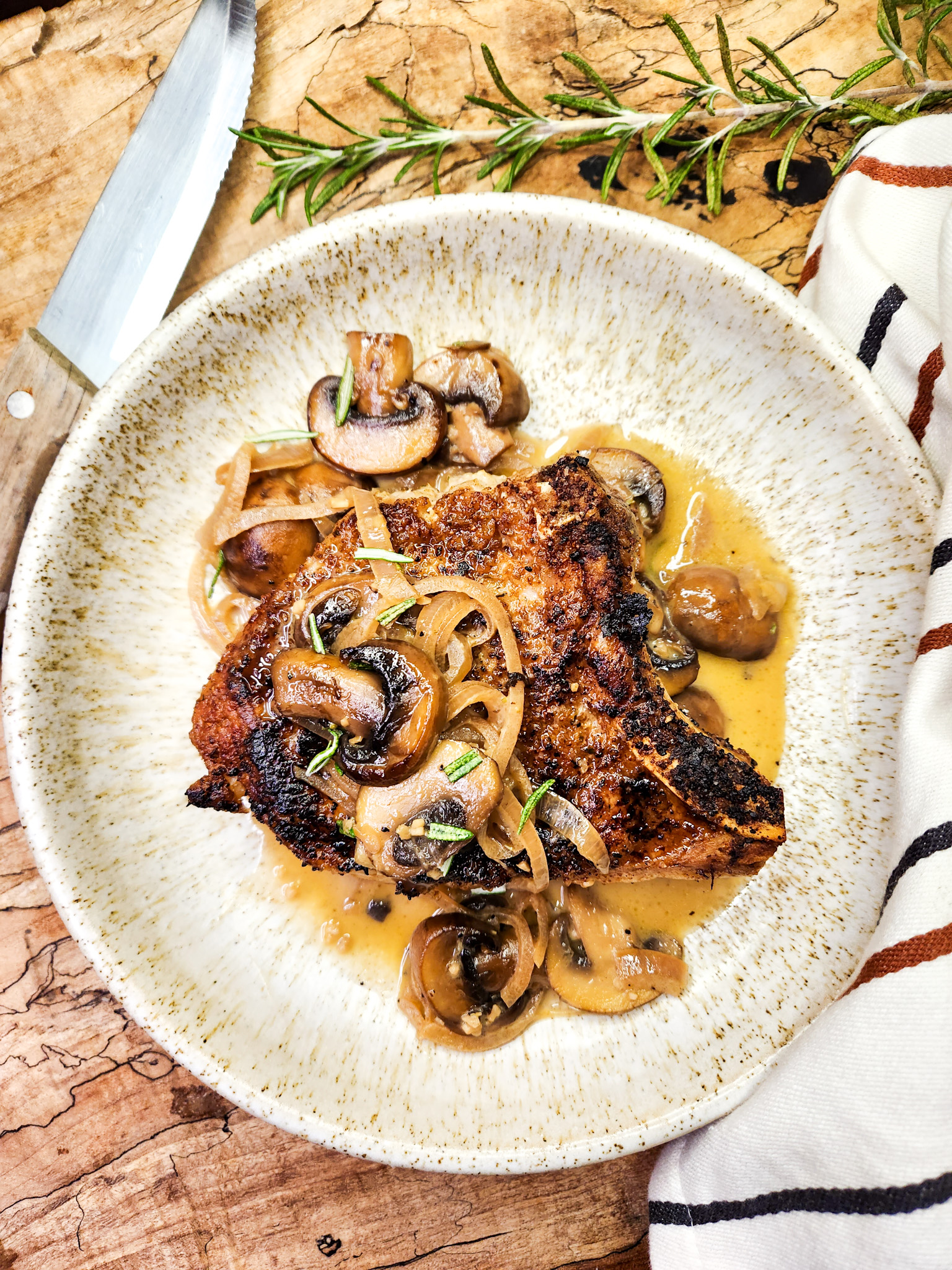 Pork Chops with Mushroom Sauce is an easy weeknight meal with seared chops and a flavorful mushroom sauce with shallot, sherry and butter