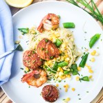 Seafood and Sweet Corn Pasta is light and citrusy with sea scallops, shrimp, sweet corn and sugar snap peas over angel hair pasta.