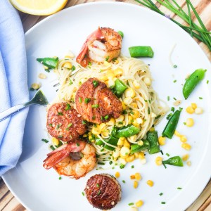 Seafood and Sweet Corn Pasta is light and citrusy with sea scallops, shrimp, sweet corn and sugar snap peas over angel hair pasta.