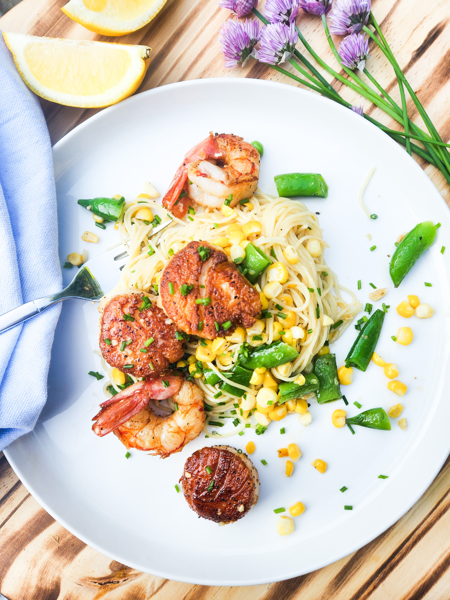 Seafood and Sweet Corn Pasta is light and citrusy with sea scallops, shrimp, sweet corn and sugar snap peas over angel hair pasta.