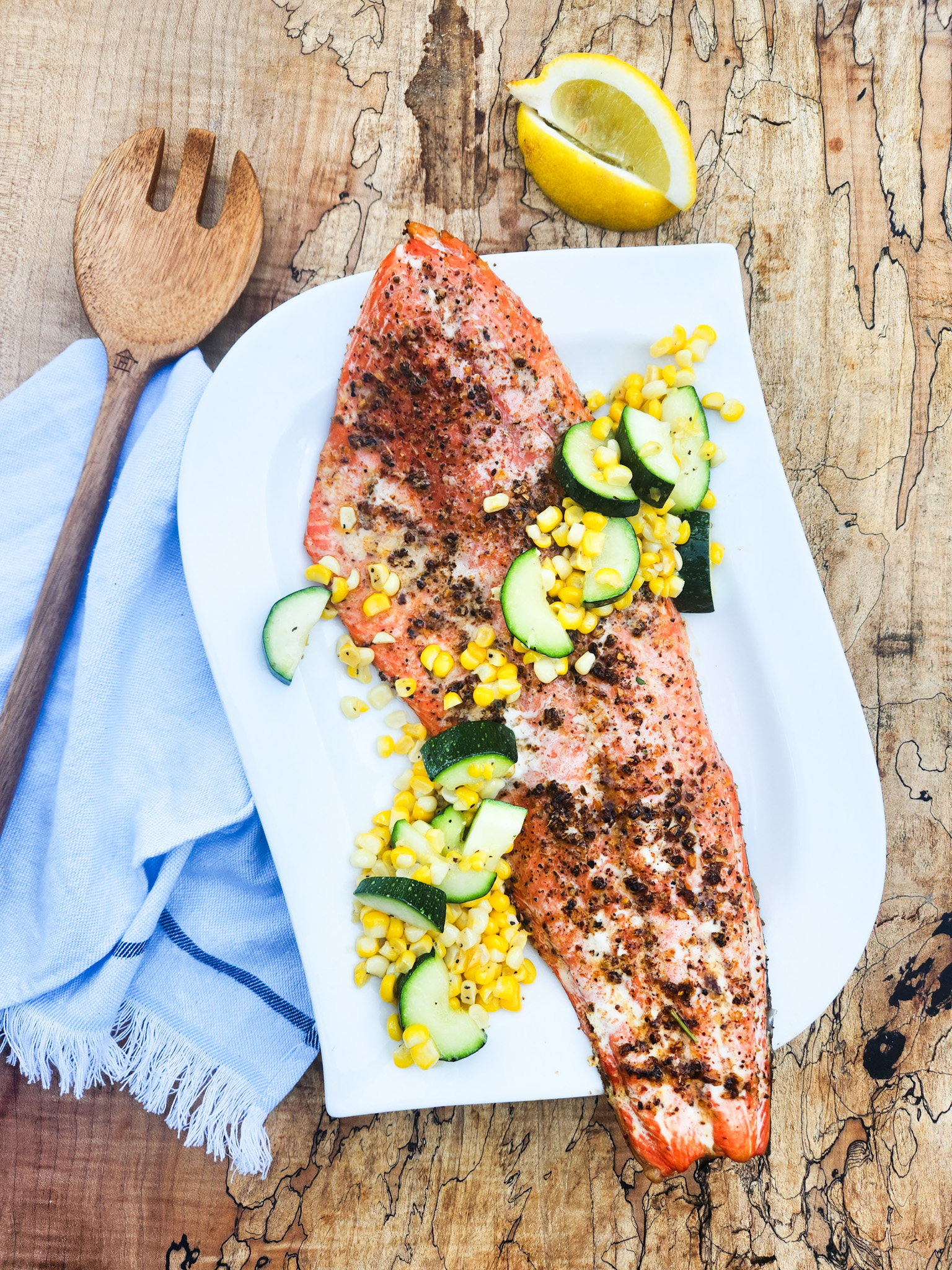 Grilled Mesquite Salmon is buttery and melt in your mouth delicious topped with lightly sauteed sweet corn and zucchini.