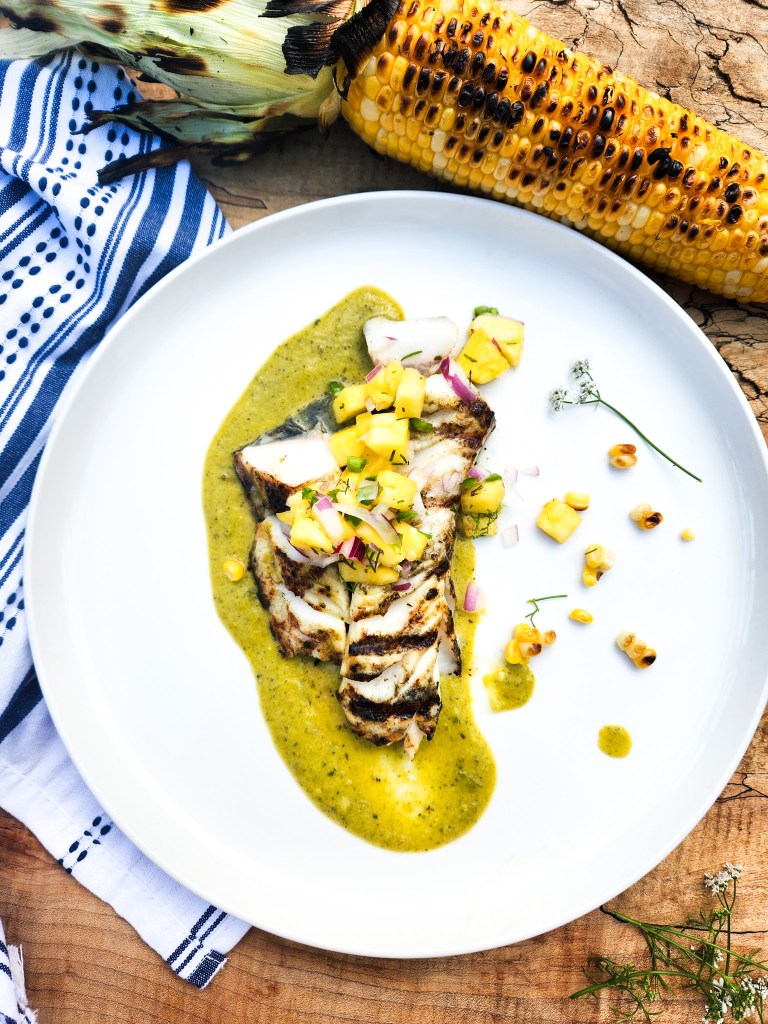 Grilled Sablefish with Roasted Poblano Vinaigrette is light, buttery and topped with a sweet and spicy pineapple salsa.