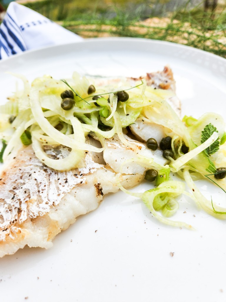 Seared Cod with Fennel Slaw highlights the simplicity of flaky cod with earthy fennel bulb, briny capers and accents of citrus.