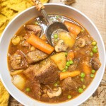 Easy Weeknight Beef Stew quickly cooked with large pieces of tri-tip steak, creamy gold potatoes, carrots, mushrooms and peas.